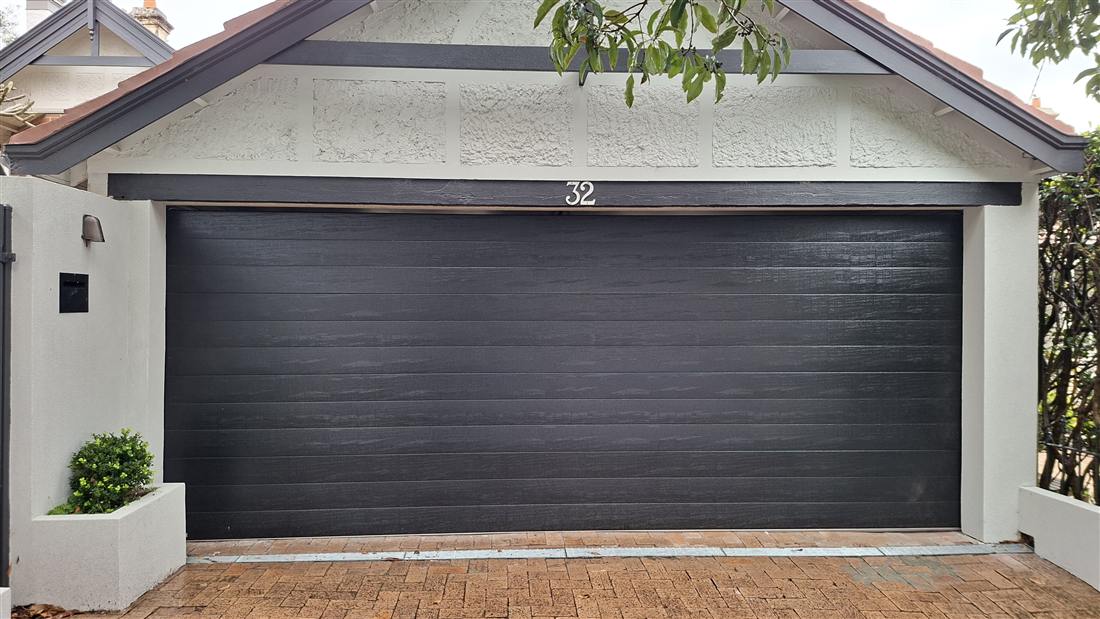 Charcoal garage door installation on a Federation-style Sydney home