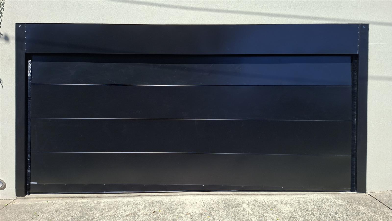 Sleek black modern garage door