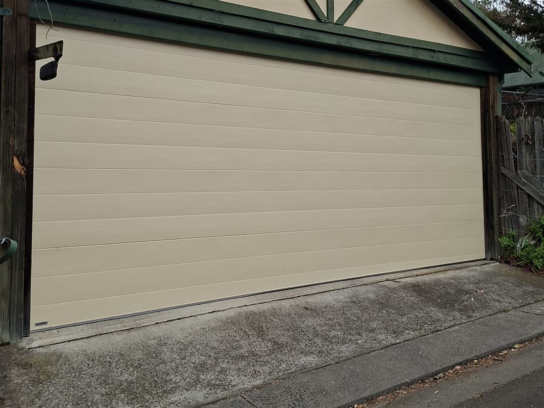 Traditional panel garage door on a house